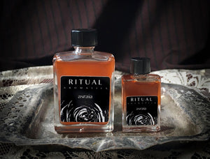 Ritual Aromatics Asraia Natural Perfume 5ml and 15ml bottles on a vintage silver tray with lace