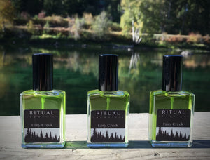 Ritual Aromatics Fairy Creek Natural Botanical Perfume bottles on a dock by water