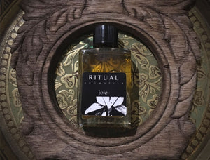 Ritual Aromatics Joie Natural Perfume 5ml bottle on a brass tray with an ornamte frame