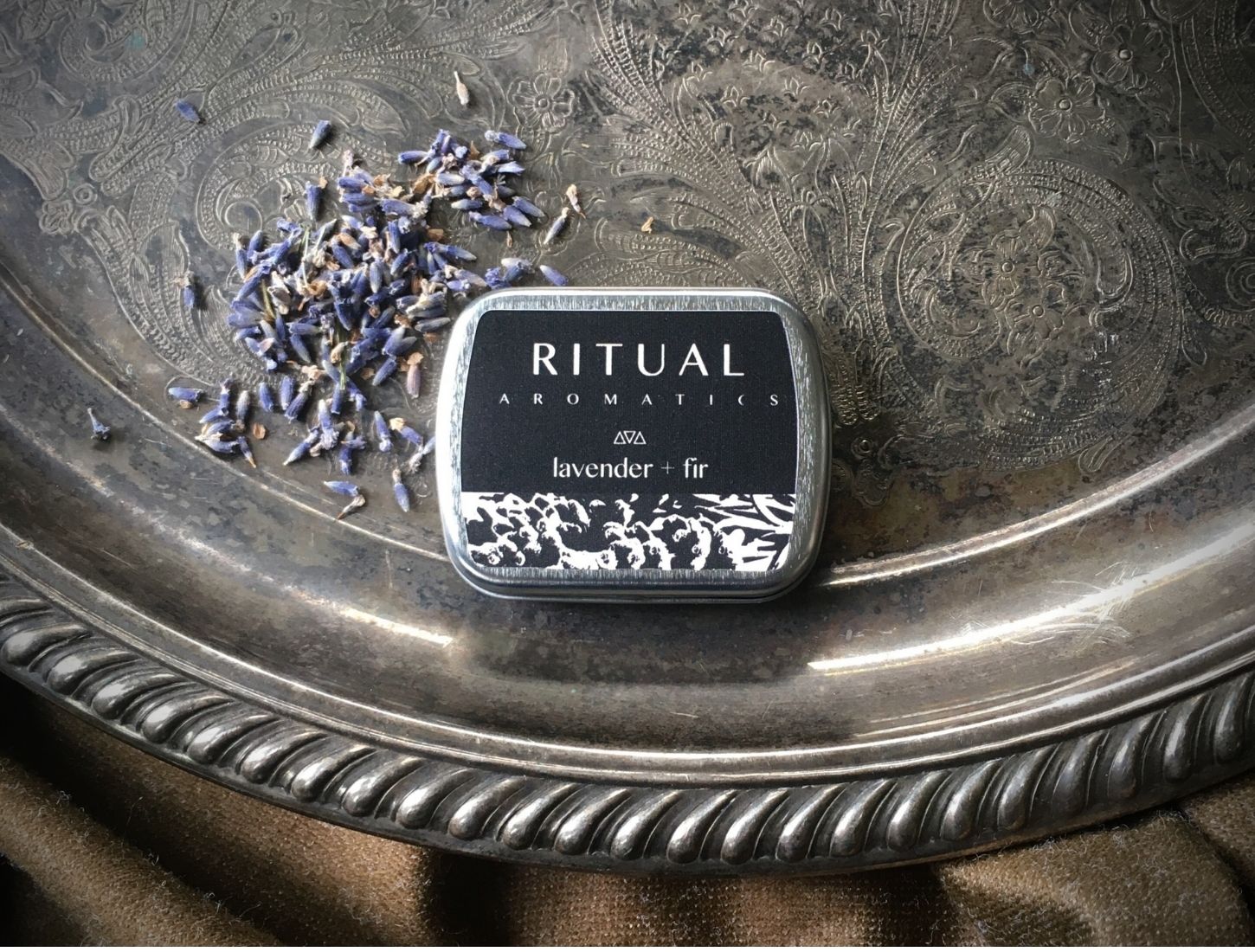 Ritual Aromatics Lavender + Fir handmade Incense Cones on a silver tray with loose lavender