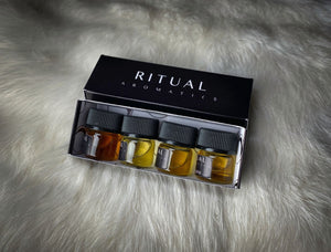 Ritual Aromatics Botanical Perfume Samples, side view, in a Black Box on White Rabbit Fur